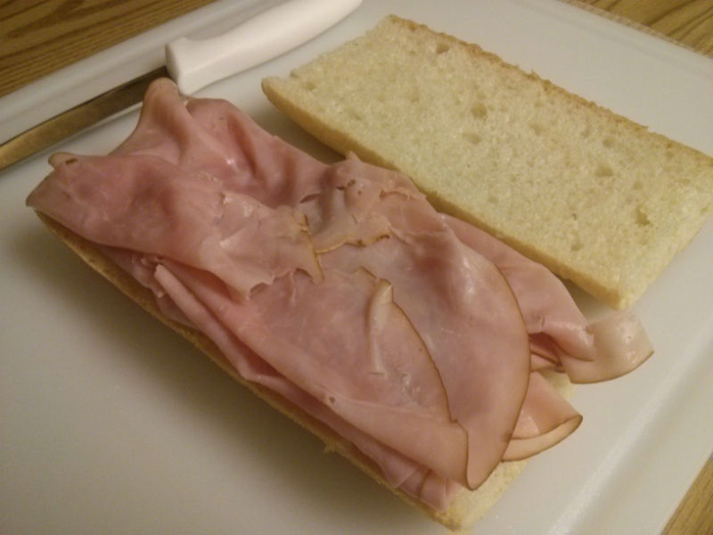 Slice bread and first layer ham