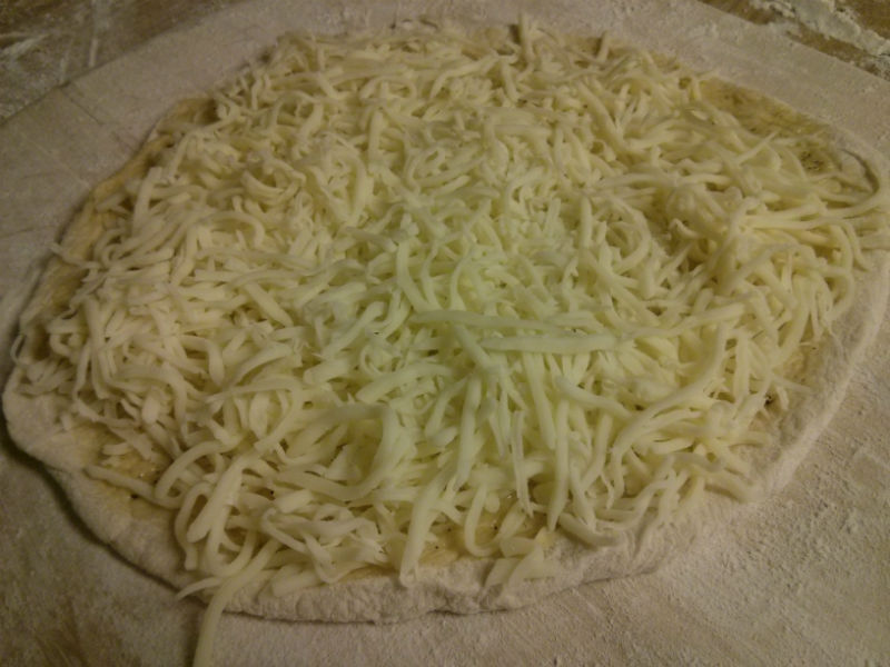 Add a generous amount of Mozzarella cheese