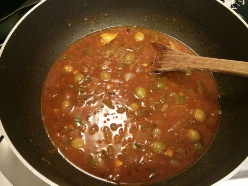 Add tomato sauce, dry seasonings, chicken broth and simmer