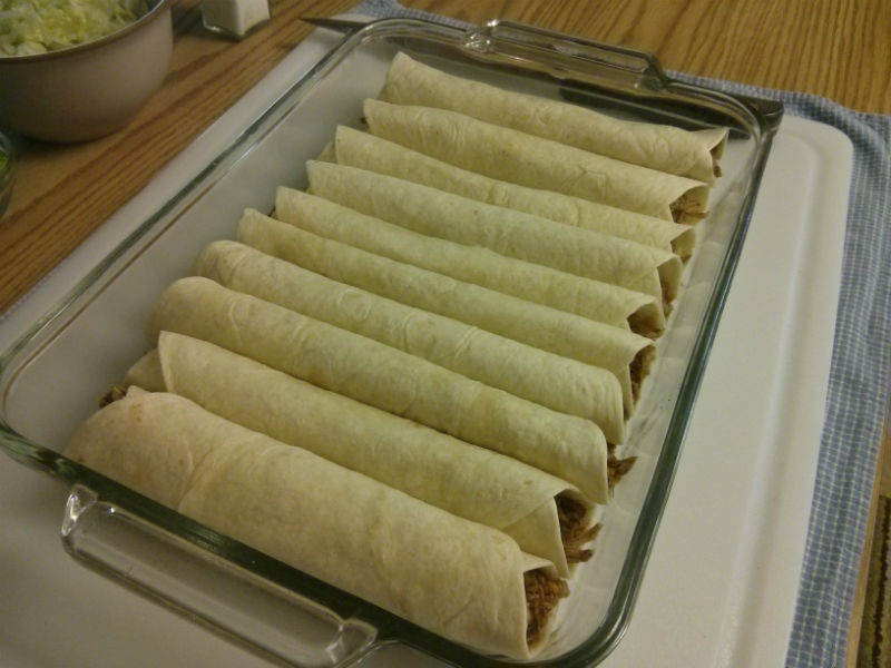Assemble each enchilada and place in baking dish