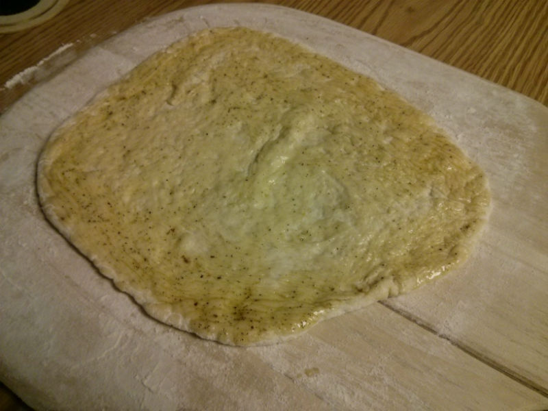 Brush dough with seasoned olive oil
