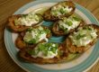 Top Potato Skins with sour cream and green onions. Serve immediately!