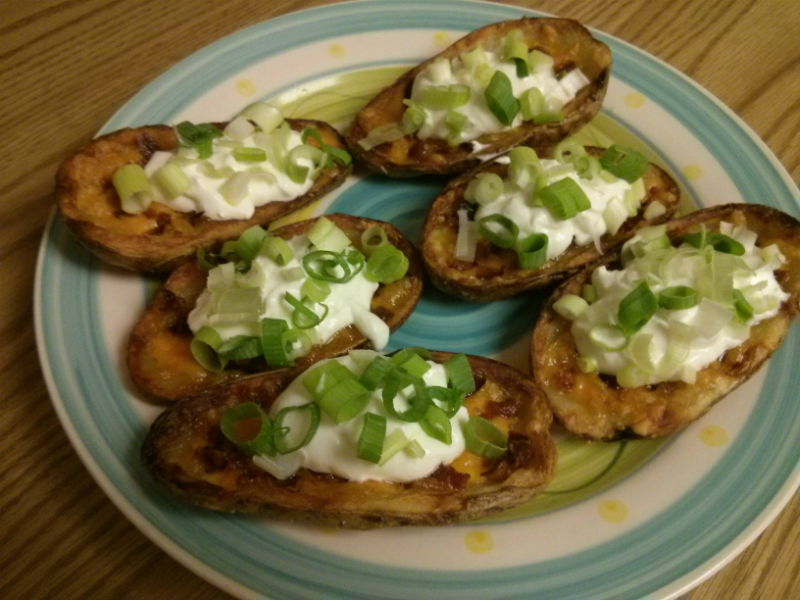 Top Potato Skins with sour cream and green onions. Serve immediately!